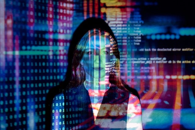 Woman with code running over her face