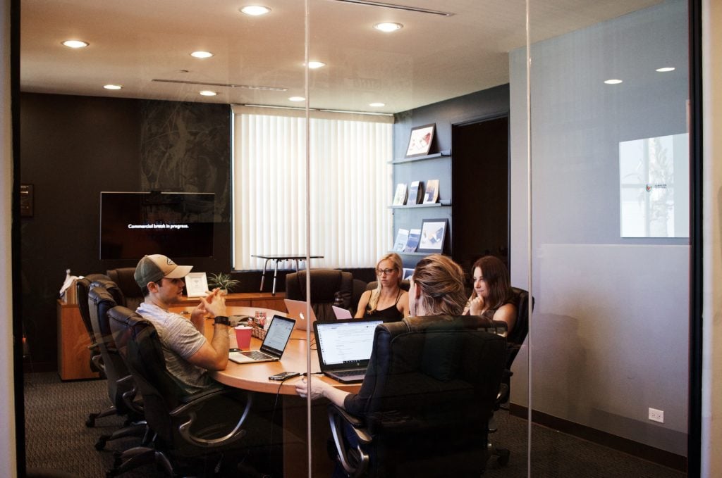 people around a table in a meeting