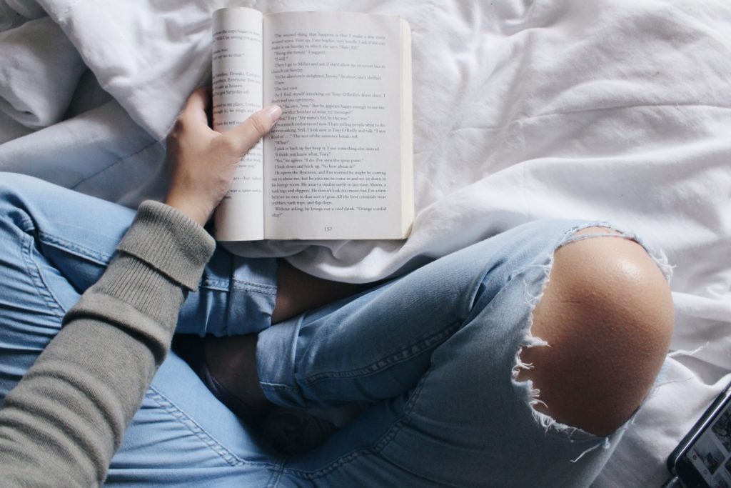 hand grabbing book