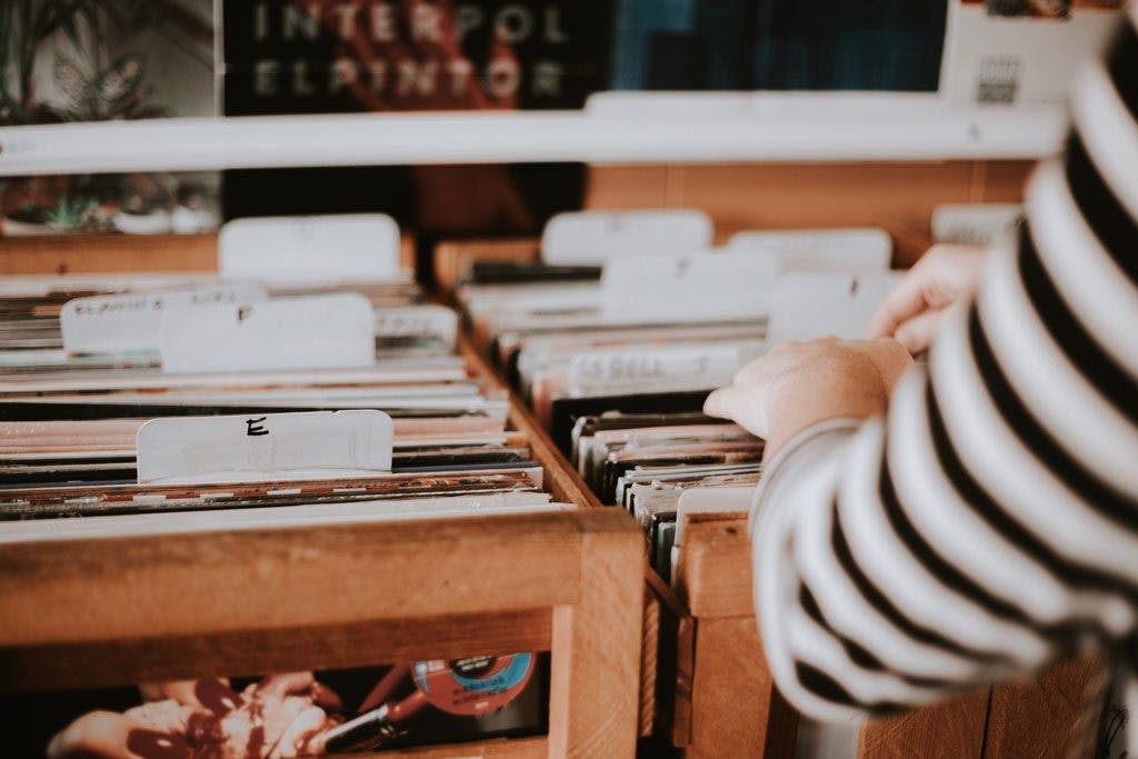 person browsing vinyl shelves