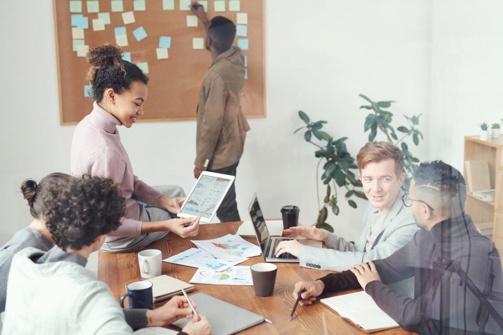 people in a meeting setting targets and KPIs