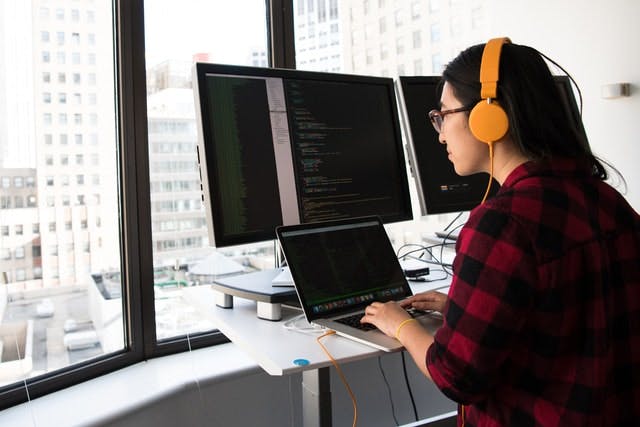 Woman coding at desk