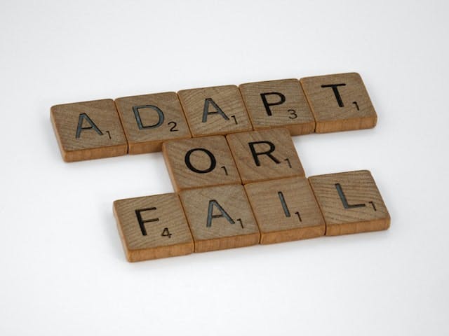 scrabble blocks that say "Adapt or fail"